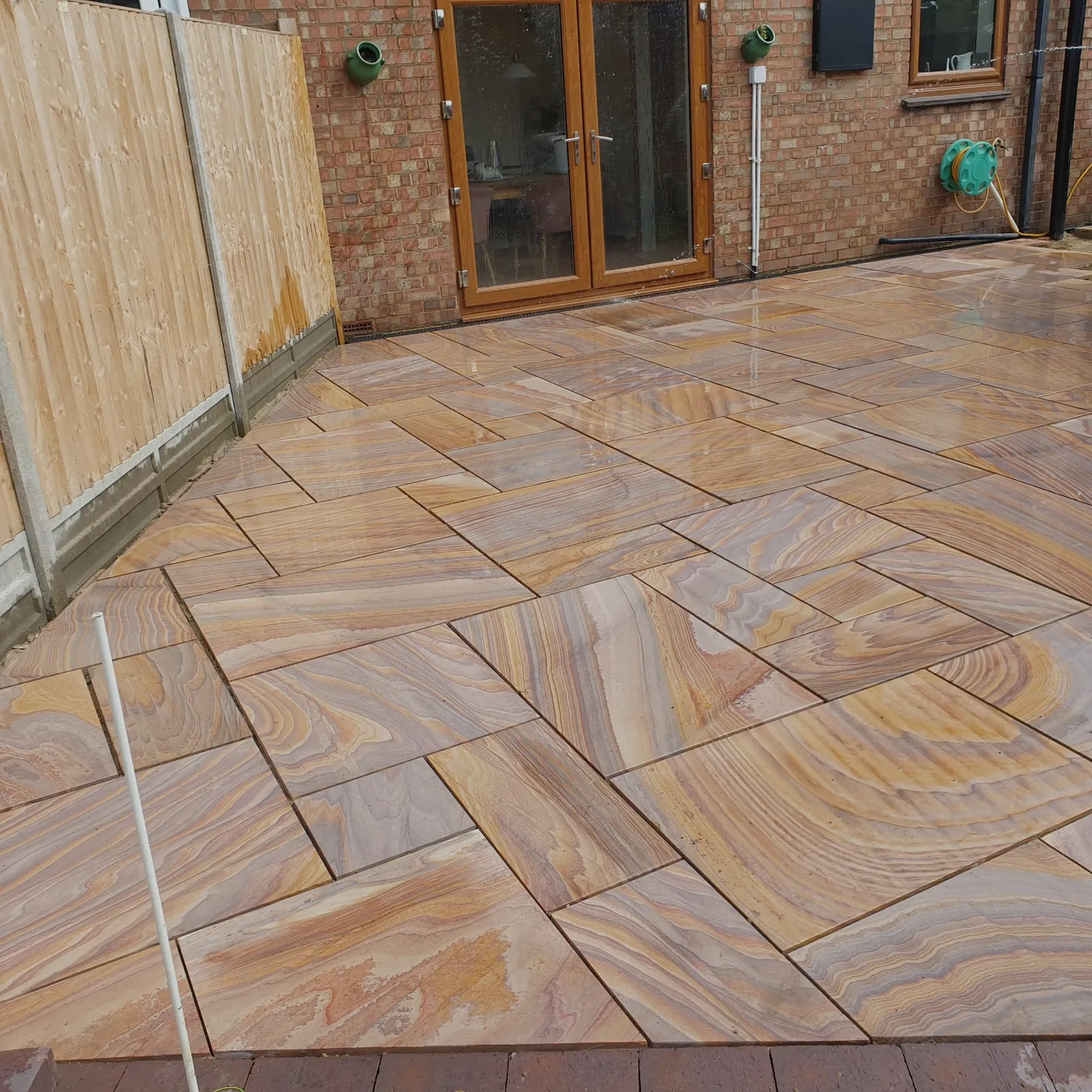 Sandstone patio laid outside patio doors