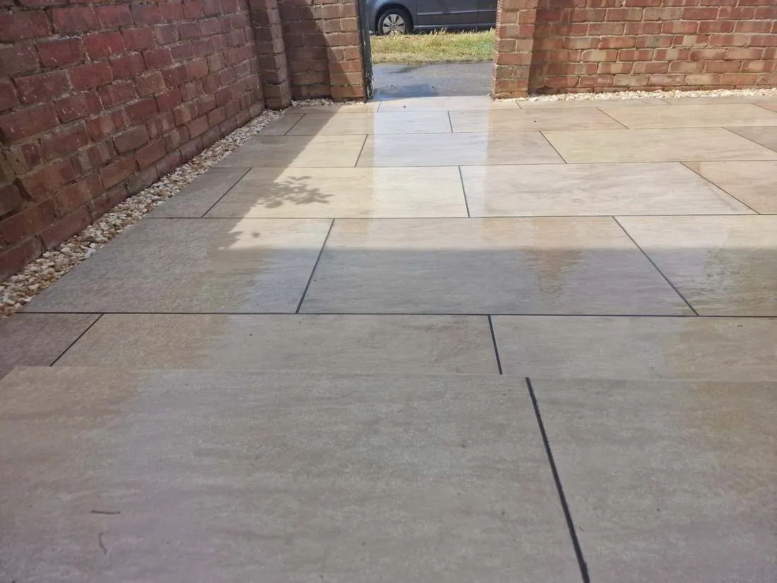 Smooth sandstone paving laid in a front courtyard by DJG Groundworks