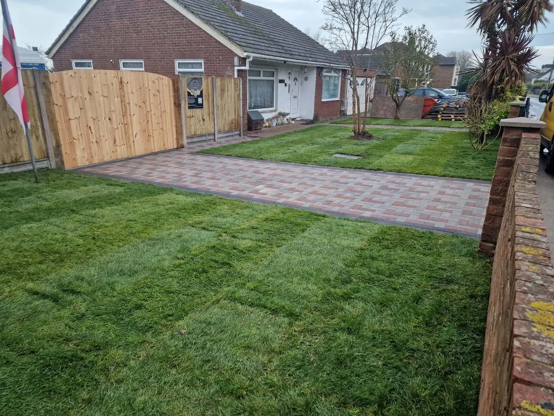 New lawn beside a block paved driveway by DJG Groundworks