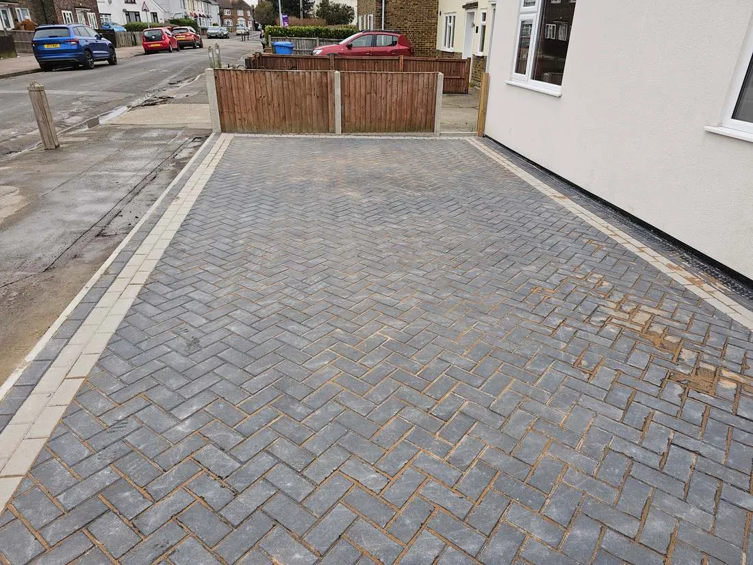Herringbone block paved driveway with a border by DJG Groundworks
