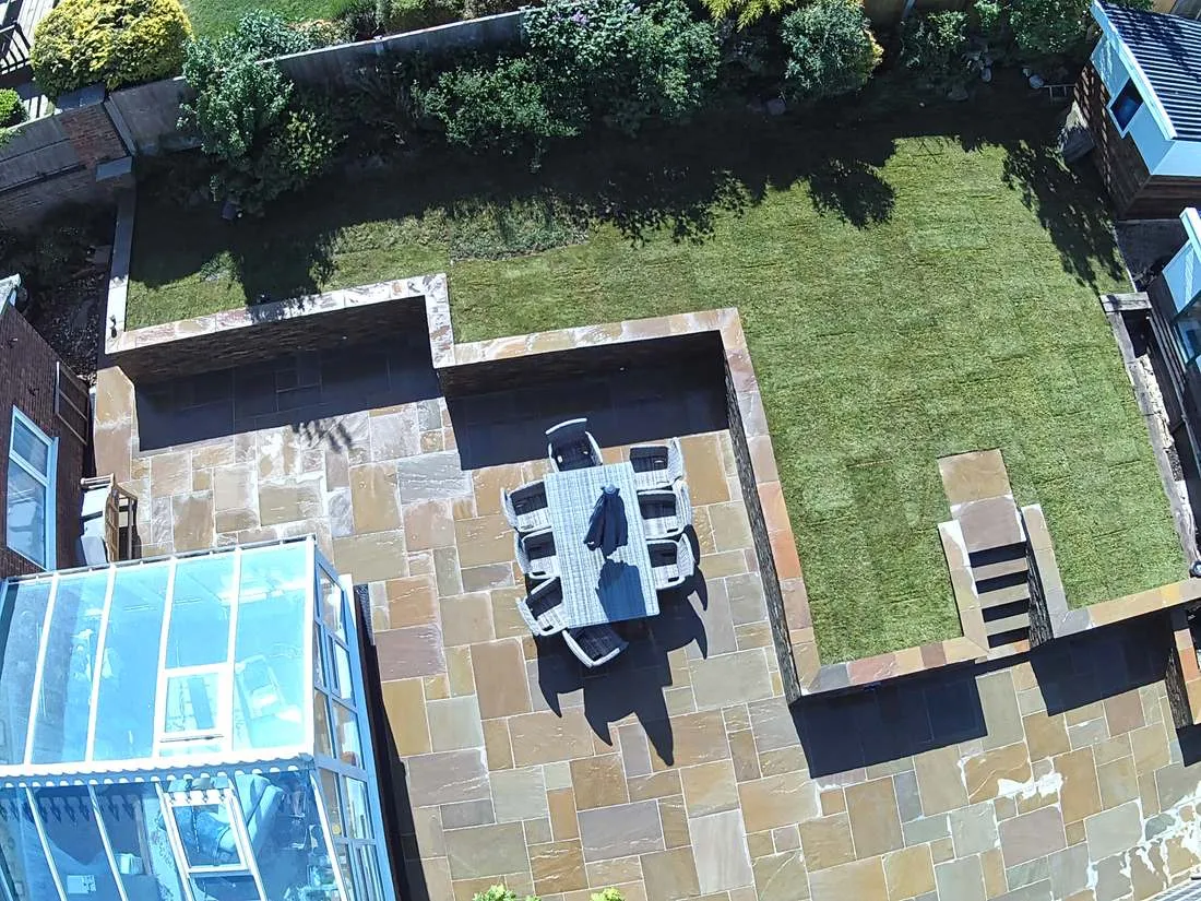 Aerial view of a sandstone patio, retaining walls and new lawn by DJG Groundworks