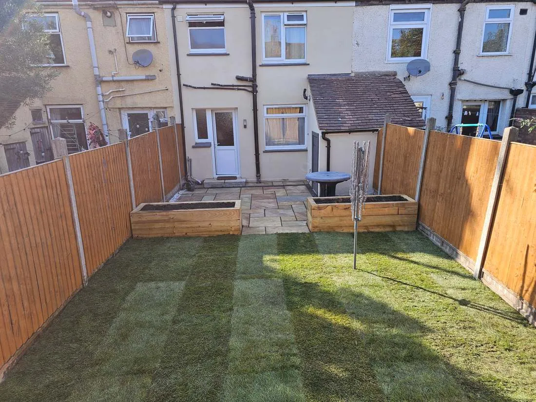 Newly turfed lawn with raised beds by DJG Groundworks
