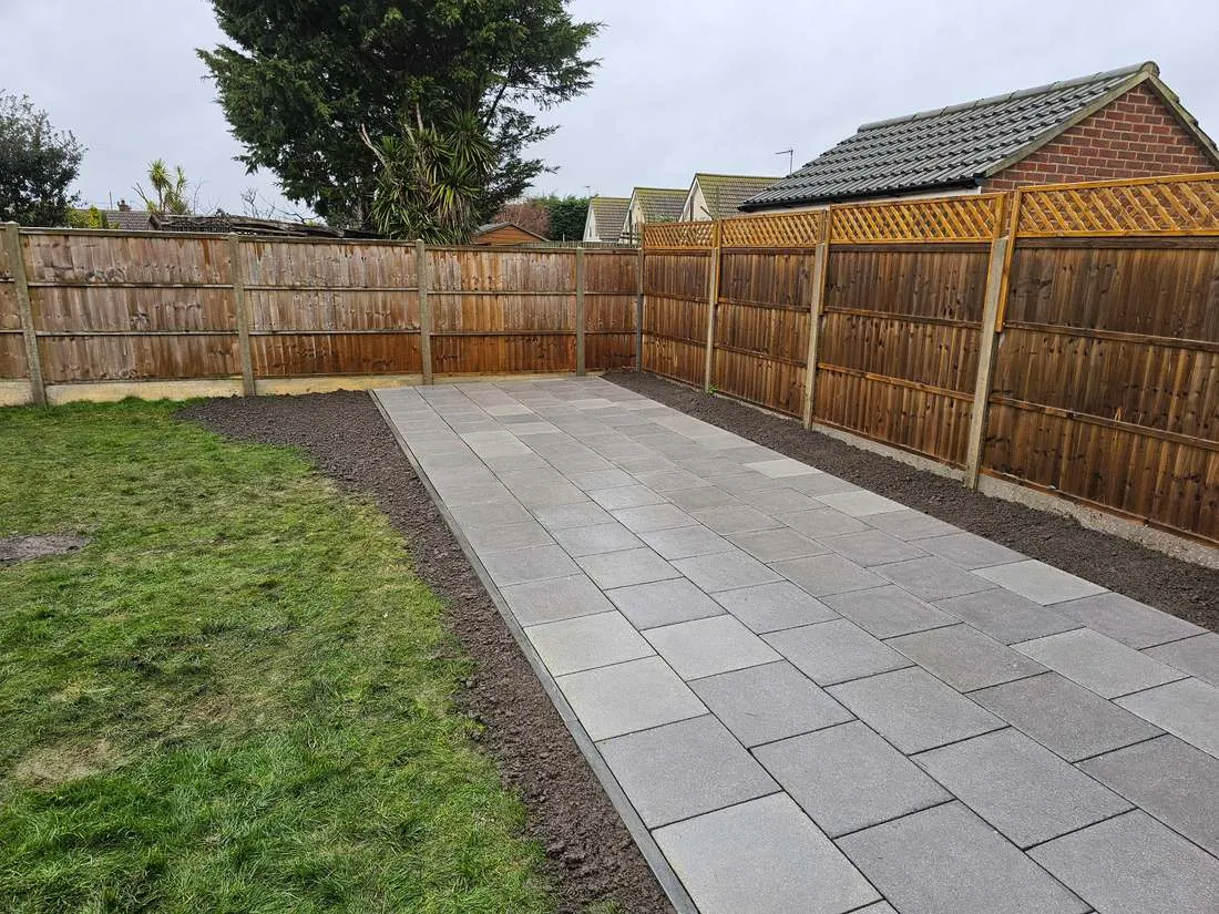 Closeboard fencing along a new paved path by DJG Groundworks