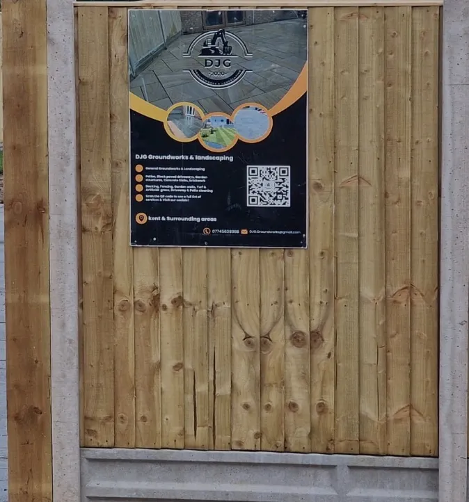 Timber closeboard fencing with DJG site board
